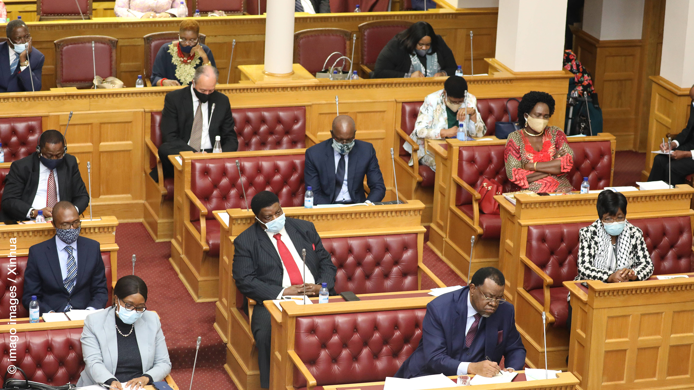 Members of Namibian parliament listen to President Hage Geingob delivering his state of the nation address in Windhoek, capital of Namibia, on June 4, 2020