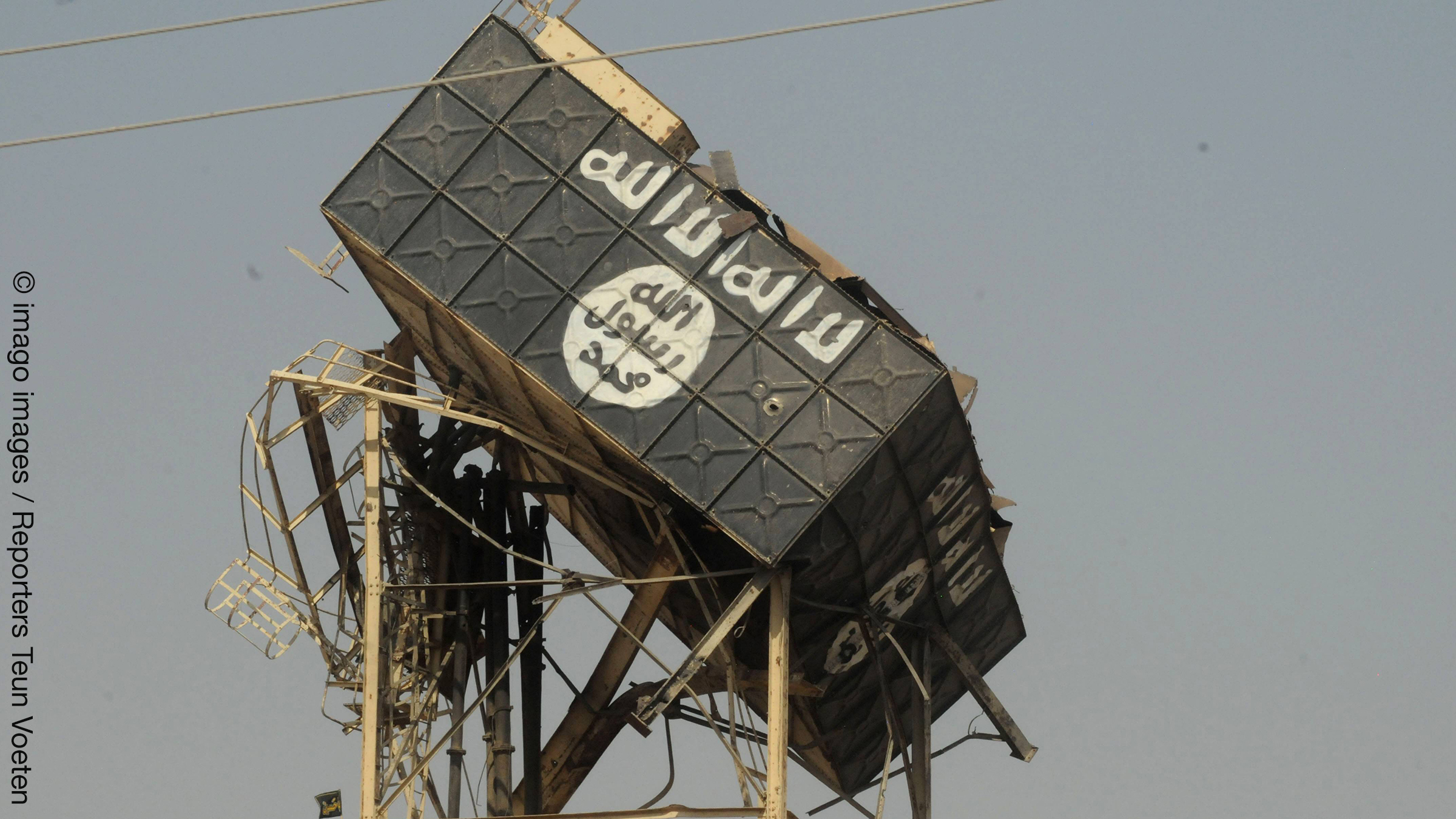 ISIS has painted their logo, the black flag, on a water tower